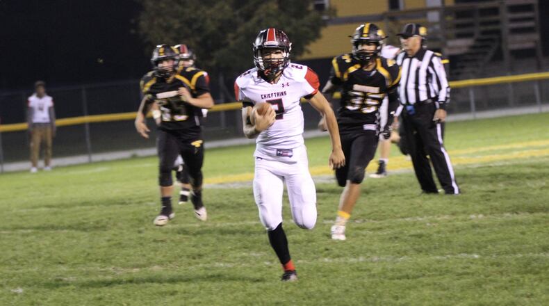 Bellefontaine’s Dezmin Lyburtus runs the ball against Shawnee on Friday evening. MICHAEL COOPER/STAFF