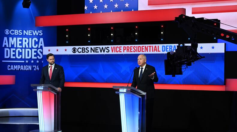 Gov. Tim Walz of Minnesota speaks as Sen. JD Vance (R-Ohio) listens during the vice-presidential debate at the CBS Broadcast Center in New York on Tuesday, Oct. 1, 2024. (Kenny Holston/The New York Times)