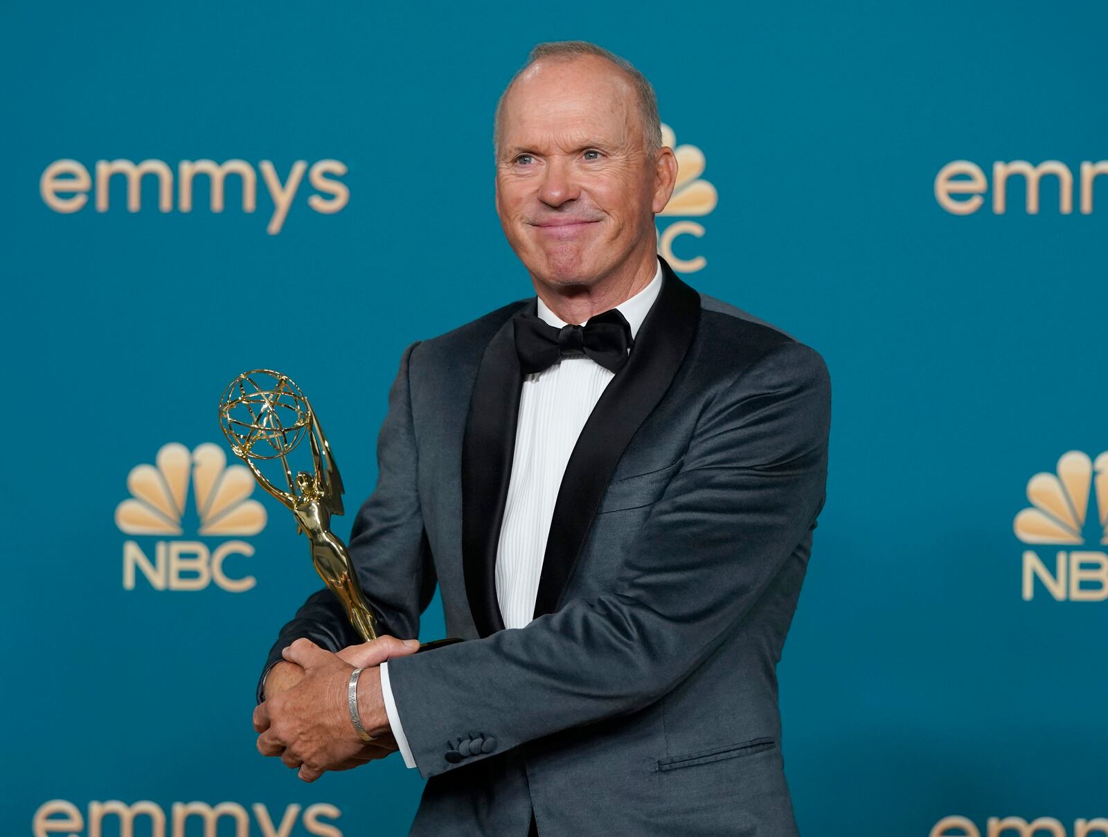Michael Keaton, winner of lead actor in a limited series or movie for "Dopesick," poses in the press room at the 74th Primetime Emmy Awards on Monday, Sept. 12, 2022, at the Microsoft Theater in Los Angeles. Former Urbana resident Beth Macy wrote the book the show was based on. (AP Photo/Jae C. Hong)