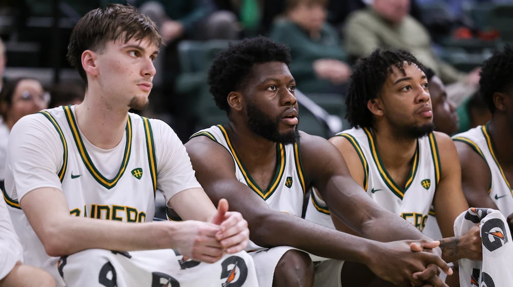 From left to right, Wright State's Kellen Pickett, Michael Imariagbe and Logan Woods watch during from the bench late in a Horizon League Championship first-round game against Cleveland State on Wednesday, March 4 at Ervin J. Nutter Center in Fairborn. BRYANT BILLING / STAFF