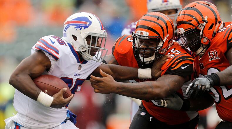 CINCINNATI, OH - OCTOBER 8: Vontaze Burfict #55 of the Cincinnati Bengals and Pat Sims #92 of the Cincinnati Bengals attempt to tackle LeSean McCoy #25 of the Buffalo Bills during the third quarter at Paul Brown Stadium on October 8, 2017 in Cincinnati, Ohio. (Photo by Michael Reaves/Getty Images)