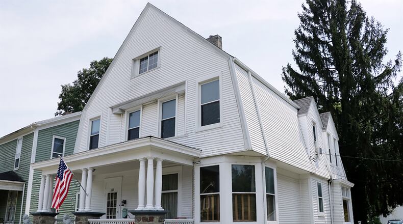 The 2-story frame house has about 2,160 sq. ft. of living space with 4 or 5 bedrooms. The house is along the downtown district of Eaton with a shared driveway that has extra off-street parking beside a carriage house with a double-overhead garage door. CONTRIBUTED PHOTO BY KATHY TYLER