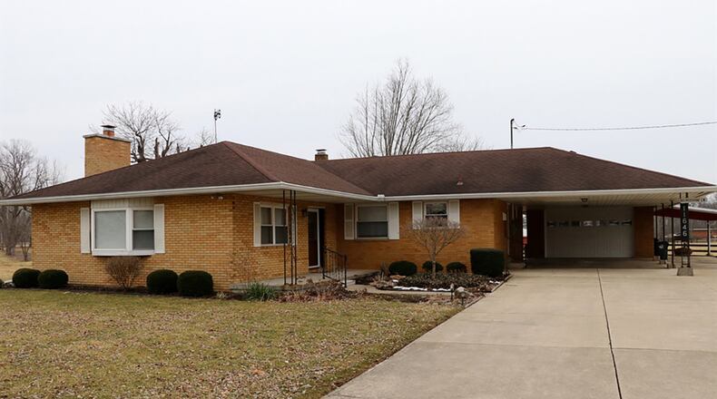 This 3-bedroom brick ranch sits on double parcel, which includes 4 acres. The house has 2 carports, a 2-car garage, a rear deck, semi-finished basement, concrete driveway with extra parking pad and a metal pole barn. CONTRIBUTED PHOTOS BY KATHY TYLER