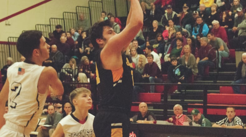 Shawnee senior D.J. Hayden shoots for two of his 17 points during the Braves’ 58-48 victory at Tecumseh on Friday night. Jeff Gilbert/CONTRIBUTED