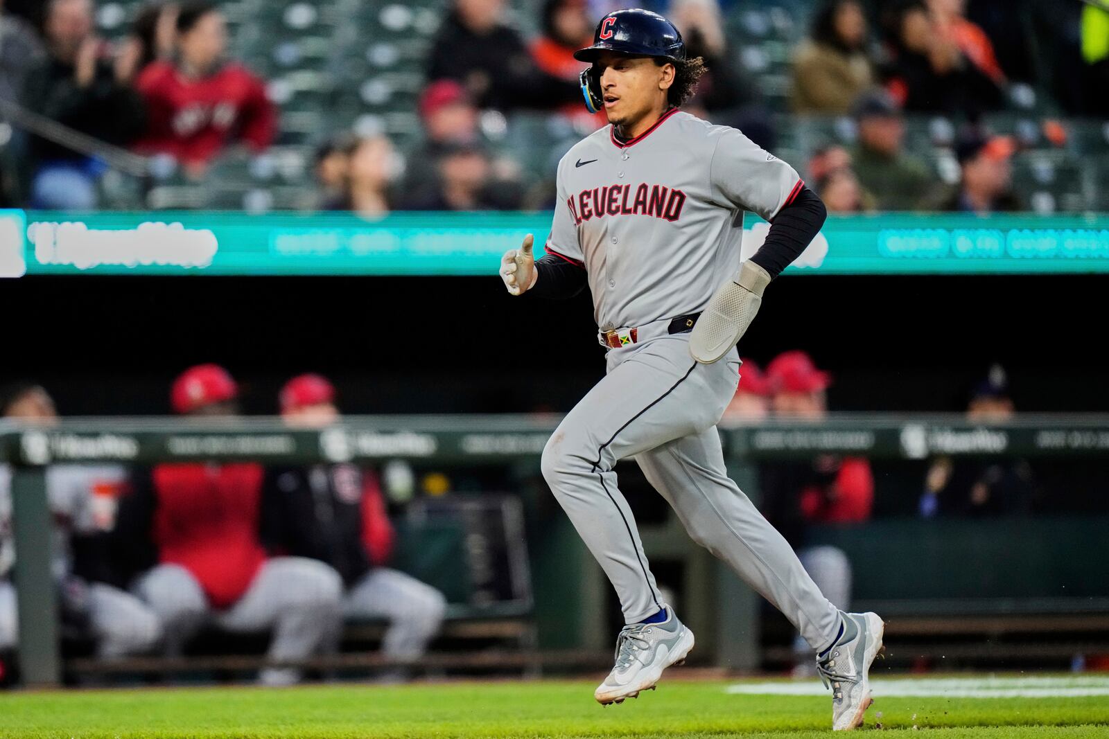 Cleveland Guardians' Bo Naylor advances toward home plate to score on a sacrifice fly hit in by José Ramírez during the third inning of a baseball game against the Baltimore Orioles, Tuesday, April 15, 2025, in Baltimore. (AP Photo/Stephanie Scarbrough)