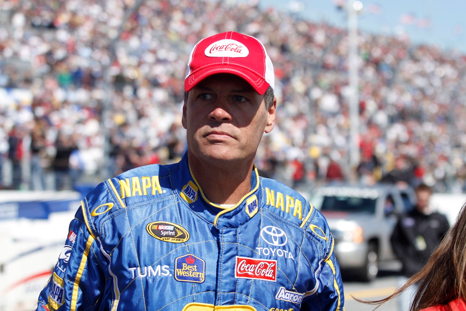 FILE - Michael Waltrip looks on at the NASCAR Daytona 500 auto race in Daytona Beach, Fla. on Feb. 14, 2010. (AP Photo/J Pat Carter, File)