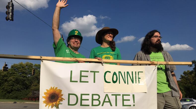 Constance Gadell-Newton, the Green Party candidate for governor, and her supporters protest that they are not allowed to take part in the Ohio governor’s candidate debate. STAFF/CHRIS STEWART