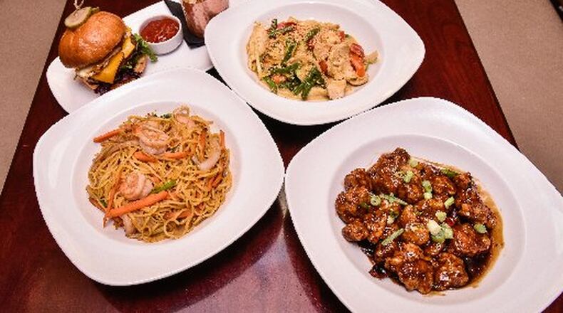 An assortment of food from Basil’s on the Market. The owners want to open a new restaurant in Piqua. GRAHAM/STAFF