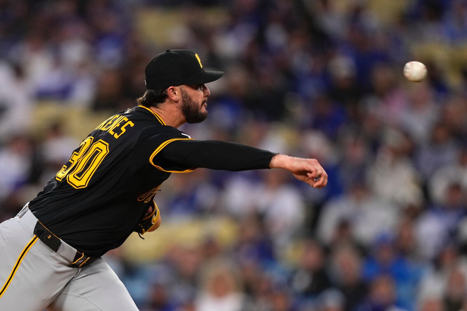 Pittsburgh Pirates starting pitcher Paul Skenes throws to the plate during the first inning of a baseball game against the Los Angeles Dodgers, Friday, April 25, 2025, in Los Angeles. (AP Photo/Mark J. Terrill)