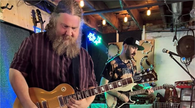 Guitarists Patrick Himes (left) and Nathan Lewis rehearsing for This Must Be the Party, the Talking Heads tribute headlining a benefit for Stivers School for the Arts’ Seedling Foundation at The Brightside in Dayton on Friday, April 14.