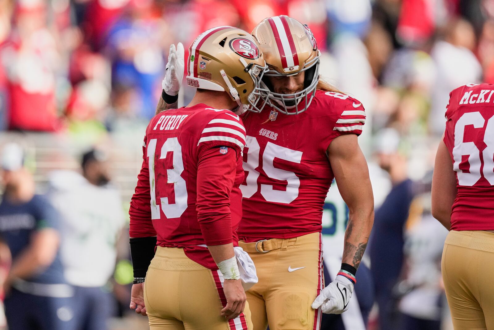 FILE - San Francisco 49ers quarterback Brock Purdy, left, celebrates with tight end George Kittle (85) after throwing a touchdown pass against the Seattle Seahawks during an NFL football game Sunday, Dec. 10, 2023, in Santa Clara, Calif. (AP Photo/Godofredo A. Vásquez, File)