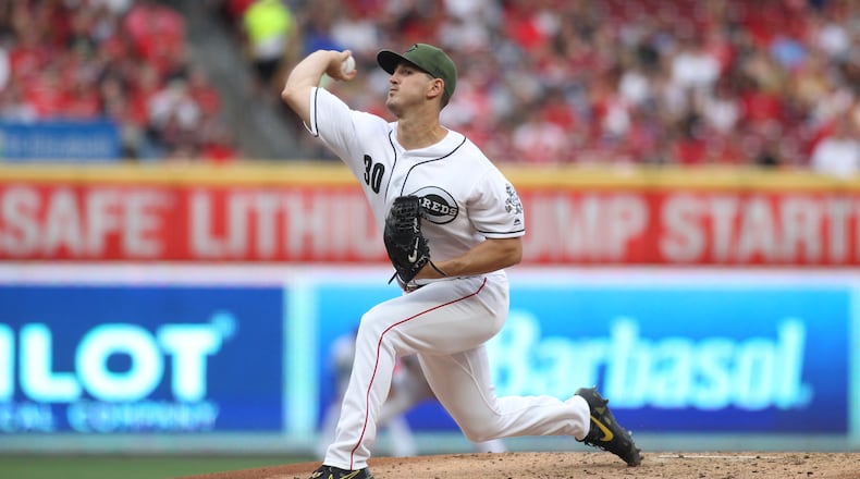 Reds starter Tyler Mahle pitches against the Rangers on Friday, June 14, 2019, at Great American Ball Park in Cincinnati. David Jablonski/Staff
