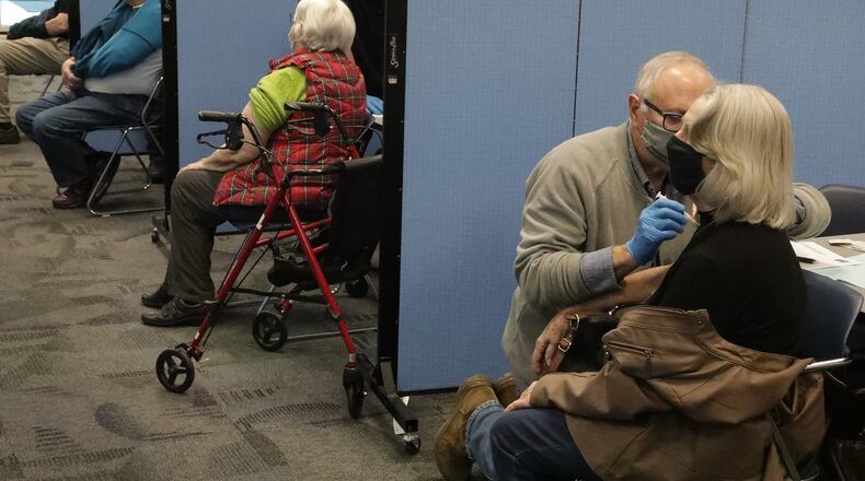 Gov. Mike DeWine released the vaccination schedule last week for Phase 1b, a group that includes Ohioans aged 65 and older, K-12 school staff and those with severe medical issues. BILL LACKEY/STAFF