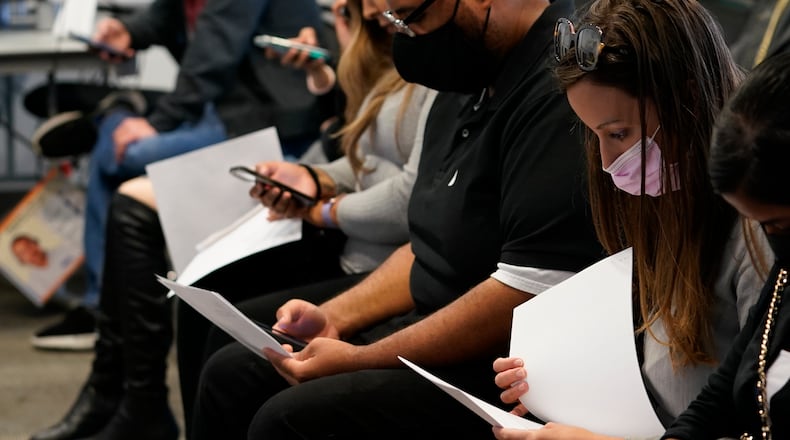 More than 150 area businesses will be looking for employees at a job fair today at the Wright State Nutter Center that comes at a critical time as employers attempt to fill empty positions. (AP Photo/Damian Dovarganes)