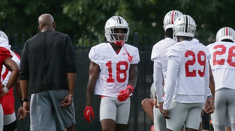Cornerback Jyaire Brown (18), of Lakota West, warms up at the the first Ohio State practice of the season on Thursday, Aug. 4, 2022, at the Woody Hayes Athletic Center in Columbus. David Jablonski/Staff
