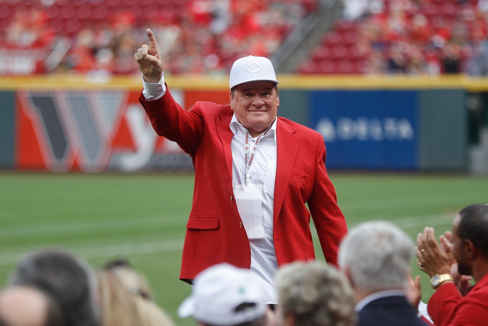 FILE - Former Cincinnati Reds player and guest Pete Ross acknowledges spectators during a Cincinnati Reds Hall of Fame induction ceremony before a baseball game against the Pittsburgh Pirates, Saturday, July 21, 2018, in Cincinnati. (AP Photo/John Minchillo, File)