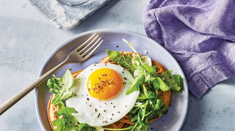 Wednesday’s Waffles With Arugula, Fried Egg and Goat Cheese Butter is the perfect breakfast for dinner. Contributed by Time Inc. Books/Caitlin Bensel