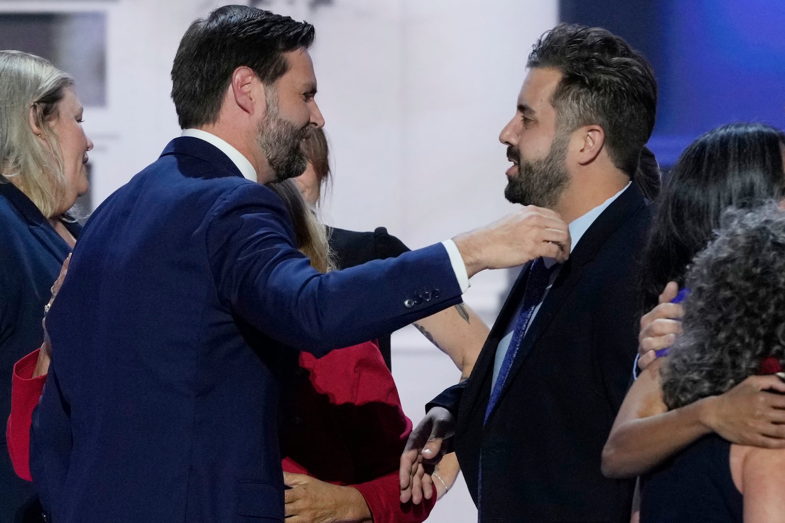 Cory Bowman, half-brother of Republican vice presidential candidate Sen. JD Vance, R-Ohio, right, hugs Vance during the Republican National Convention, Wednesday, July 17, 2024, in Milwaukee. (AP Photo/J. Scott Applewhite)