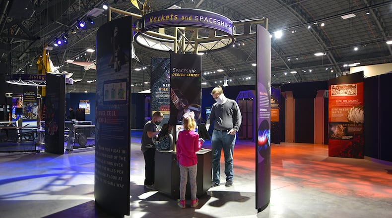 (From left) Levi and Laney Daniel, along with their uncle, Ben Thomas, try their hand at designing spacecraft in the National Museum of the U.S. Air Force’s newest temporary exhibit, “Space: A Journey to Our Future.” The exhibit opened Jan. 28 and closes Sept. 6. U.S. AIR FORCE PHOTO/KEN LAROCK