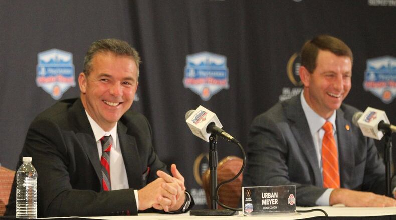 Ohio State’s Urban Meyer and Clemson’s Dabo Swinney speak at a Fiesta Bowl press conference on Friday, Dec. 30, 2016, at the Camelback Inn in Scottsdale, Ariz. David Jablonski/Staff
