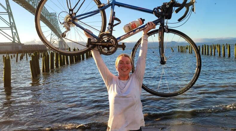 Dayton native Gillian Garland in Astoria, Oregon, at the tail-end of her 10-state journey on the TransAmerica Bicycle Trail.