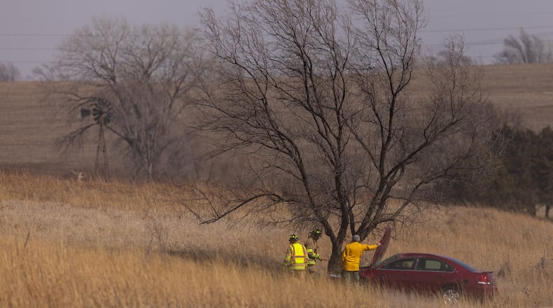 Malcolm and Lincoln firefighters respond to a wildfire in Denton, Neb., on Thursday, March 12, 2026. (Kenneth Ferriera/Omaha World-Herald via AP)