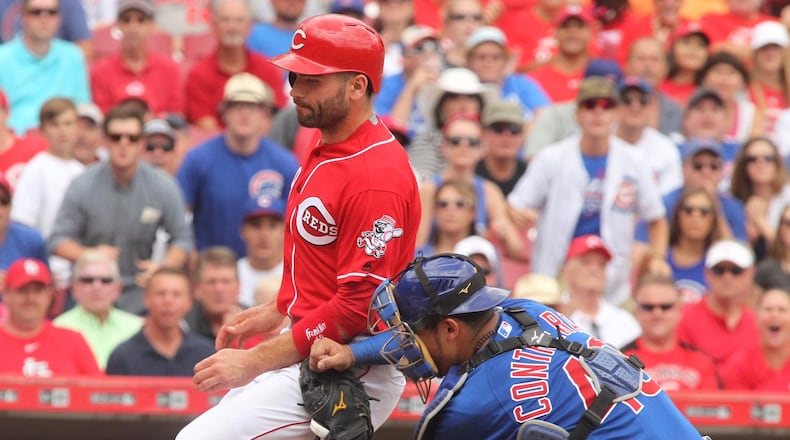 The Reds’ Joey Votto is tagged out at the plate on Wednesday, June 29, 2016, at Great American Ball Park in Cincinnati. David Jablonski/Staff