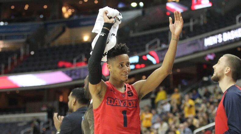 Dayton's Darrell Davis celebrates a basket by the Flyers against Virginia Commonwealth on Thursday, March 8, 2018, at Capital One Arena in Washington, D.C.