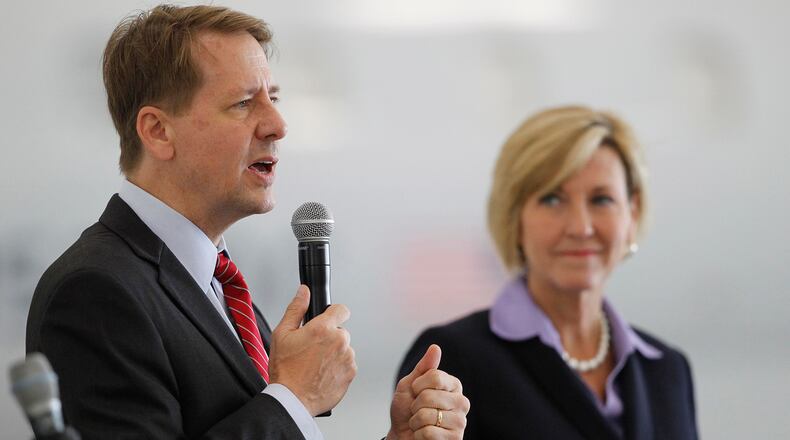 Candidate for Ohio governor Richard Cordray is shown with his running mate, Betty Sutton, during a Dayton Chamber of Commerce meeting on Thursday, Aug. 16. TY GREENLEES / STAFF