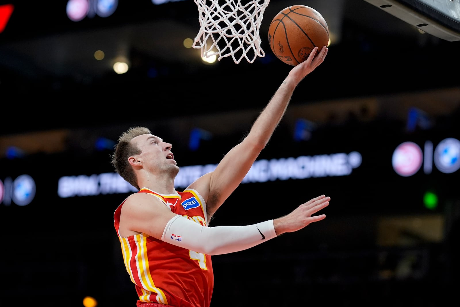 Atlanta Hawks guard Luke Kennard (4) shoots against the Indiana Pacers during the second half of an NBA basketball game, Monday, Jan. 26, 2026, in Atlanta. (AP Photo/Mike Stewart)