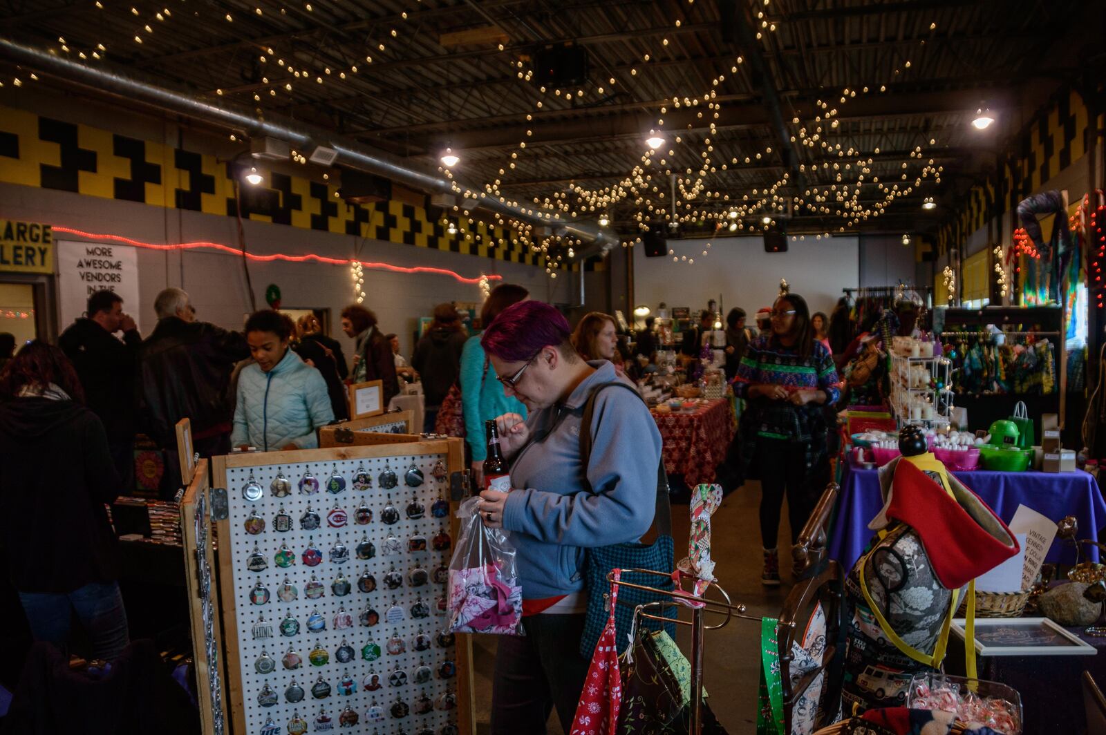Local vendors set up shop with handmade wares to give and get for the holidays at the Old Yellow Cab Tavern in Dayton. (TOM GILLIAM)