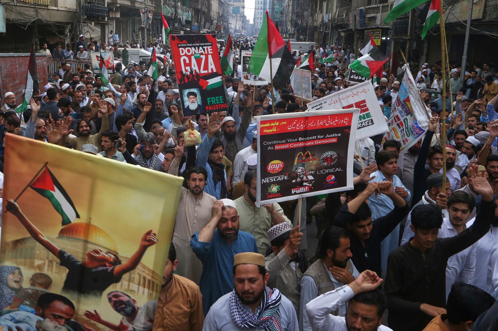 Traders hold a demonstration against Israeli airstrikes and to show solidarity with Palestinian people living in Gaza, in Peshawar, Pakistan Friday, April 18, 2025. (AP Photo/Muhammad Sajjad)