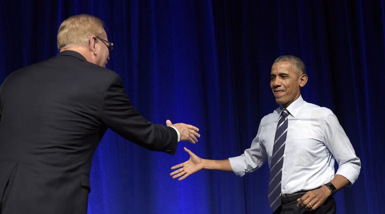President Barack Obama, right, shakes hands with former Ohio Gov. Ted Strickland, left, as he arrives to speak at a campaign event for the Ohio Democratic Party and Strickland’s Senate bid at the Greater Columbus Convention Center in Columbus, Ohio, Thursday, Oct. 13, 2016. (AP Photo/Susan Walsh)