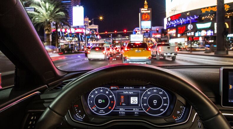 This vehicle display connected to traffic signal data counts down the seconds until the light turns green. (Audi)