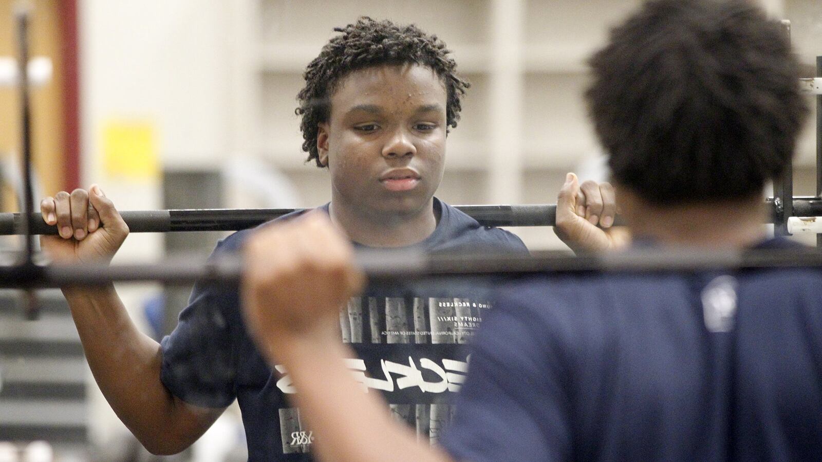 Ponitz High School football quarterback Xavier Henry carries a 3.7 GPA at Dayton Early College Academy. Henry is being honored at the National Football Foundation “That’s My Boy” Awards Dinner. TY GREENLEES / STAFF