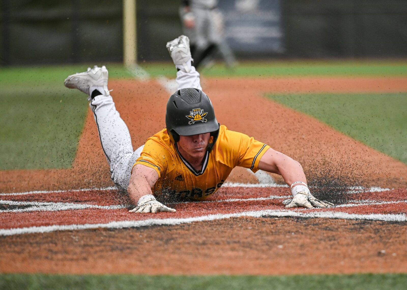 NKU's Colton Kucera slides into home during a game this season. NKU Athletics photo