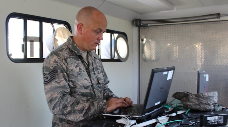 Tech. Sgt. Josh Foley demonstrates communication equipment that will be used in hurricane recovery. JEFF Guerini/STAFF