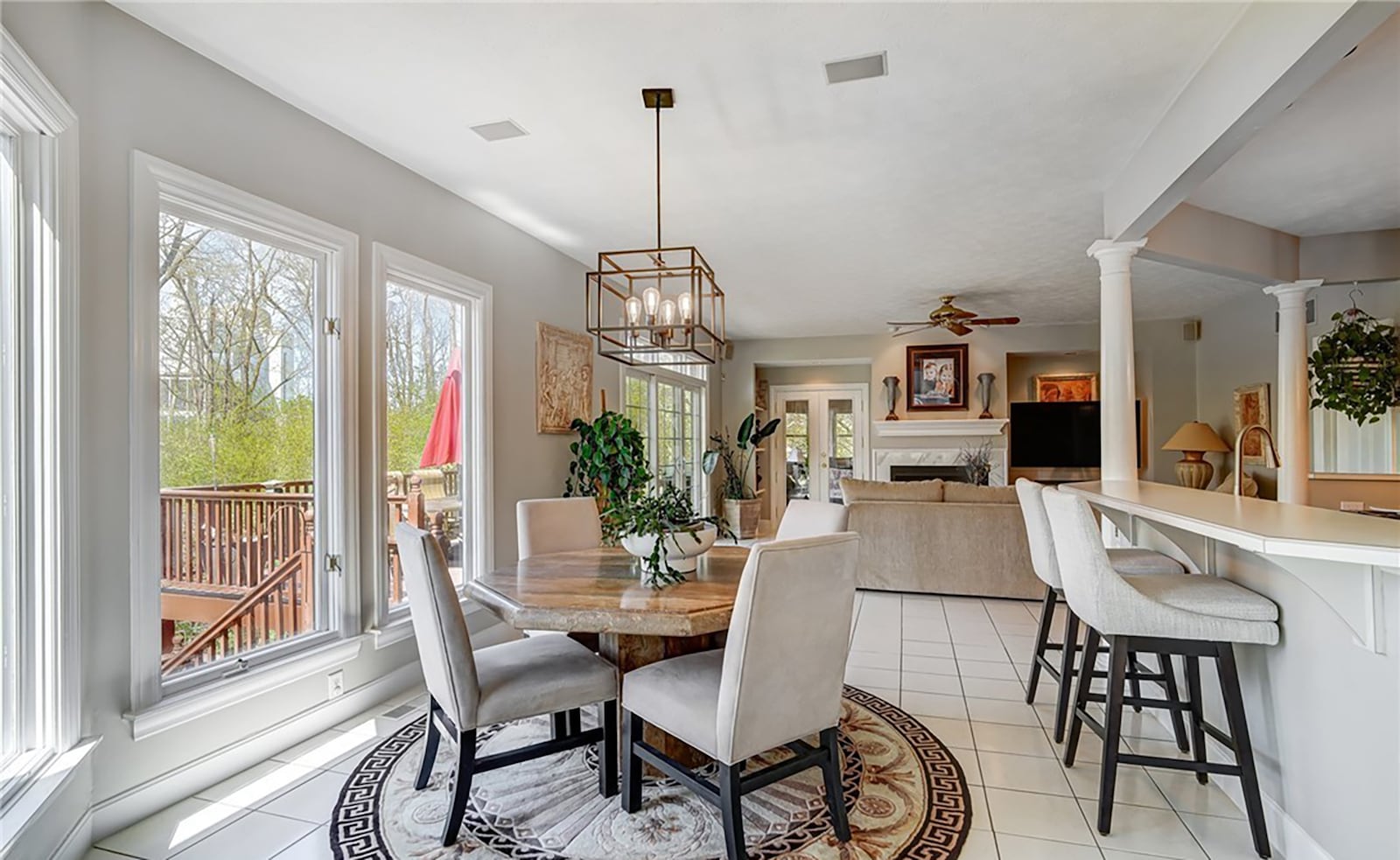 the eat in kitchen is open to the family room, which has a gas fireplace and ceiling fan.