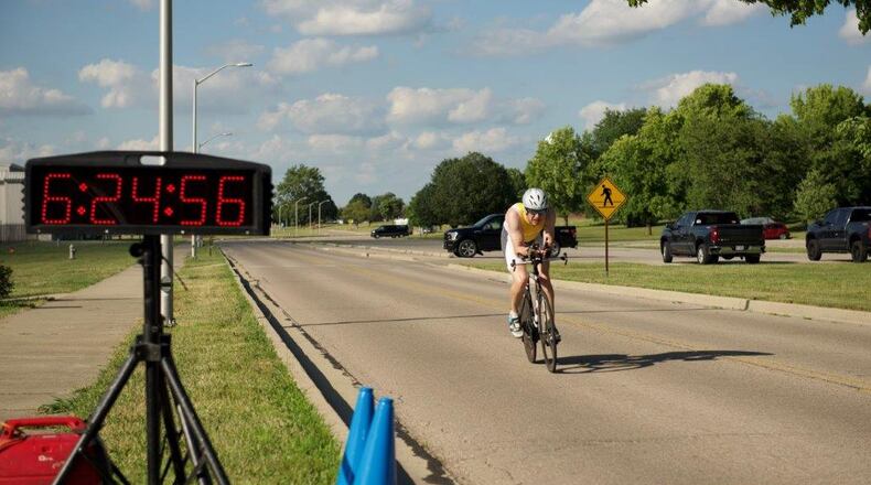 A rider crosses the finish line during the Blue Streak Time Trial race July 12 at Wright-Patterson Air Force Base. U.S. AIR FORCE PHOTO/AIRMAN 1ST CLASS JAMES JOHNSON