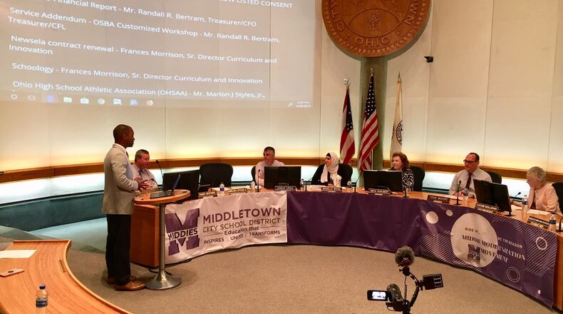 After rejecting his plan in January, Middletown school board members unanimously approved Superintendent Marlon Styles Jr.’s (left at podium) revised, $10 million expansion plan of Rosa Parks Elementary at Monday evening’s board meeting.(Photo by Michael D. Clark/Journal-News)
