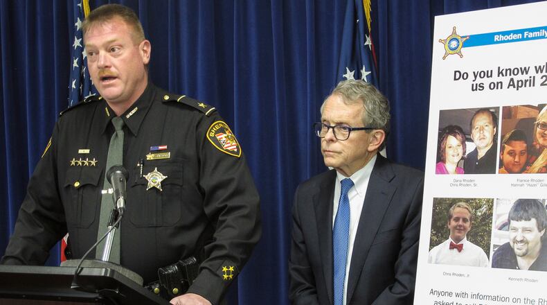 Pike County Sheriff Charles Reader, left, discusses the ongoing investigation into the unsolved killings of eight family members in southern Ohio on April 22, 2016, at a news conference attended by Attorney General Mike DeWine, whose office is leading the investigation, on Thursday, April 13, 2017, in Columbus, Ohio. Reader and DeWine both said they believe individuals may be holding back information out of fear of self-incrimination over their own, unrelated drug crimes. (AP Photo/Andrew Welsh-Huggins)