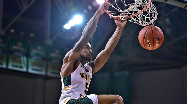 Wright State’s Skyelar Potter dunks home two of his team-high 17 points during Thursday’s win over Northwestern Ohio at the Nutter Center. Joseph Craven/CONTRIBUTED