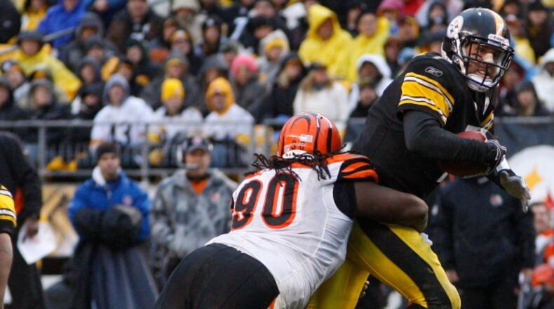 PITTSBURGH - DECEMBER 12: Ben Roethlisberger #7 of the Pittsburgh Steelers is sacked by Pat Sims #90 of the Cincinnati Bengals during the game on December 12, 2010 at Heinz Field in Pittsburgh, Pennsylvania. (Photo by Jared Wickerham/Getty Images)