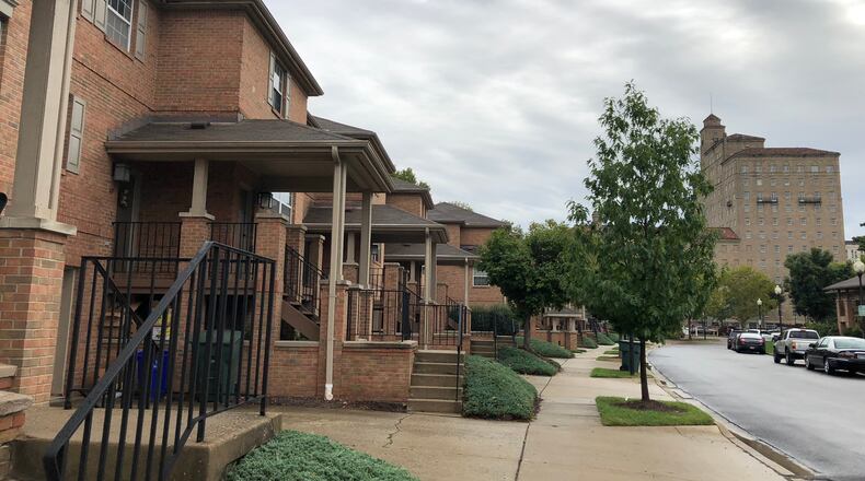 The Landing townhouses and the 13-story apartment building along Monument Avenue in downtown Dayton. CORNELIUS FROLIK / STAFF