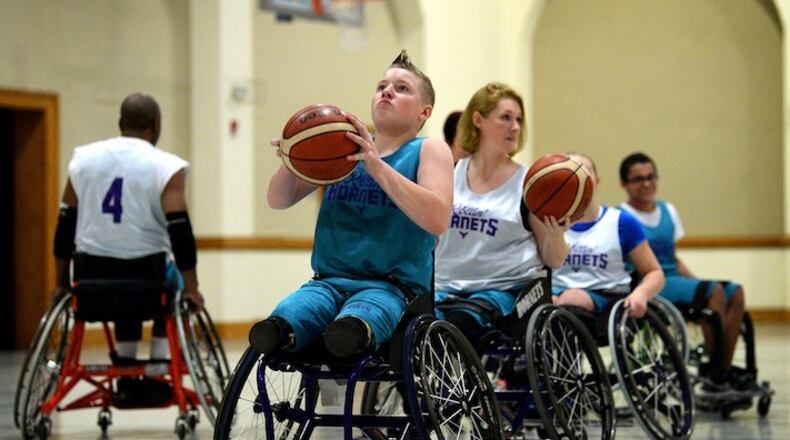 Landon Benton, 14, shoots a free throw as his mother, Rochelle, follows behind during a shooting drill at practice on Dec. 4, 2017 at Providence Presbyterian Church in Charlotte, N.C. (Jeff Siner/Charlotte Observer/TNS)
