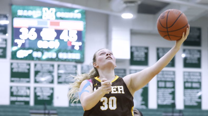 Archbishop Alter's Maddie Moodie goes to the hoop during a 55-41 win over Summit Country Day Silver Knights in their Division II District final basketball game Friday, Feb. 24, 2023 at Mason Middle School. NICK GRAHAM/STAFF