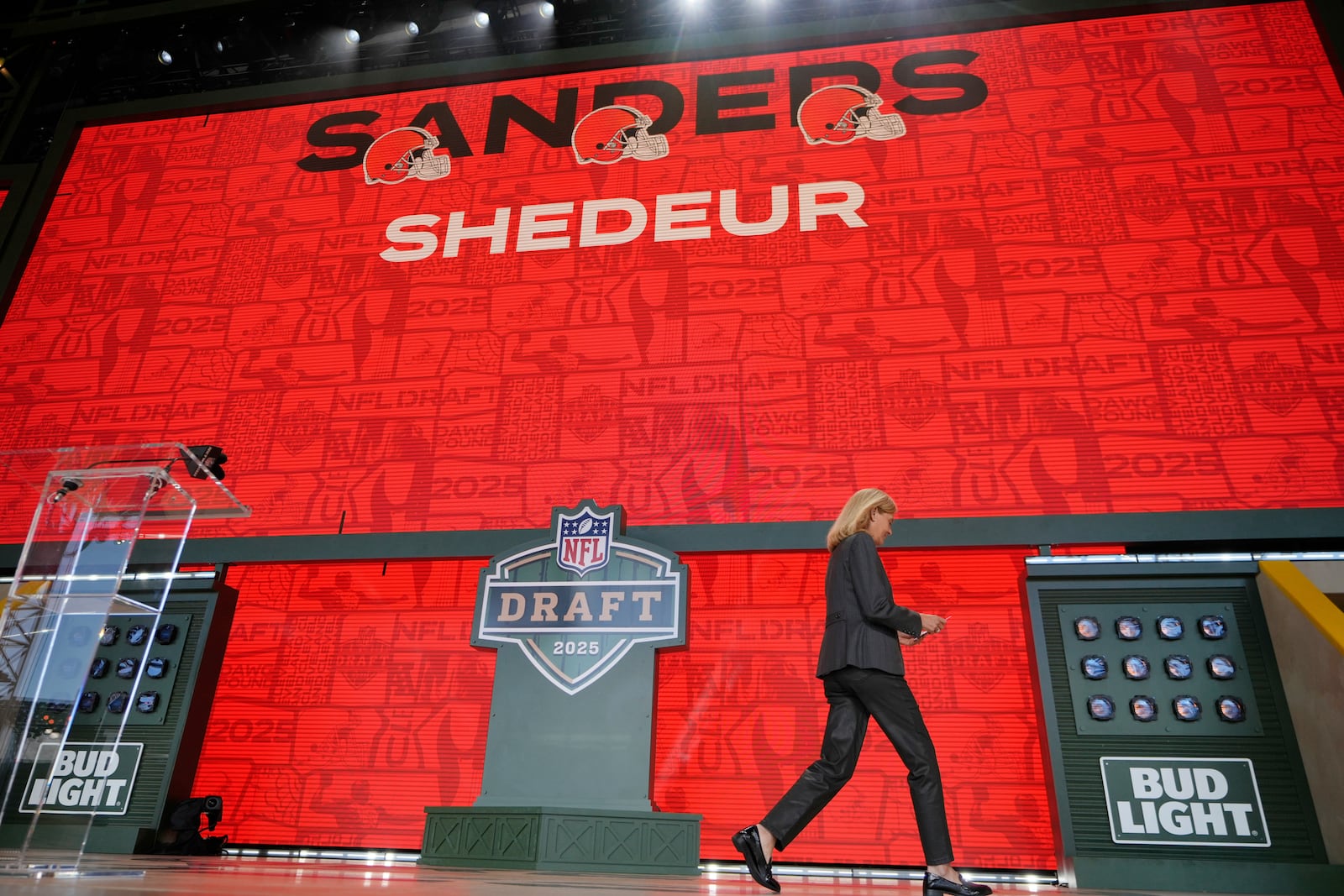 A screen shows Colorado quarterback Shedeur Sanders after being chosen by the Cleveland Browns with the 144th overall pick during the third day of the NFL football draft, Saturday, April 26, 2025, in Green Bay, Wis. (AP Photo/Jeff Roberson)