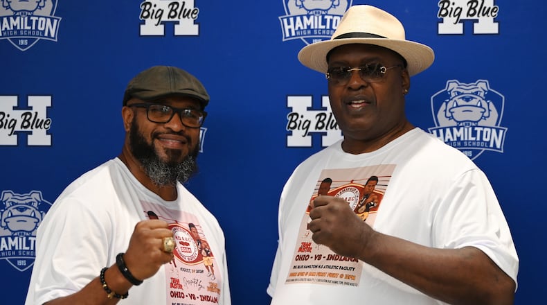 Former heavyweight boxing champions Lamon Brewster (left) and James "Buster" Douglas, pictured here at Hamilton High School on July 17, 2024, are leading a pair of teams of boxers for the Hamilton Ohio Amateur Boxing Classics happening at the high school on Saturday, Aug. 24. The pair will have a bowling fundraiser the day prior on Aug. 23 at Pohlman Lanes in Hamilton where people can bowl with the champs.  MICHAEL D. PITMAN/STAFF
