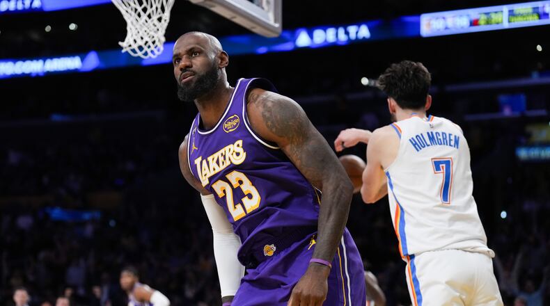 Los Angeles Lakers forward LeBron James (23) reacts after making a dunk during the first half of an NBA basketball game against the Oklahoma City Thunder Monday, Feb. 9, 2026, in Los Angeles. (AP Photo/Jae C. Hong)