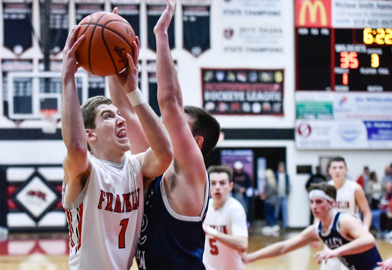 Franklin’s Jared Kinzer puts up a shot over Valley View’s Ben Herman on Friday night at Darrell Hedric Gym in Franklin. NICK GRAHAM/STAFF